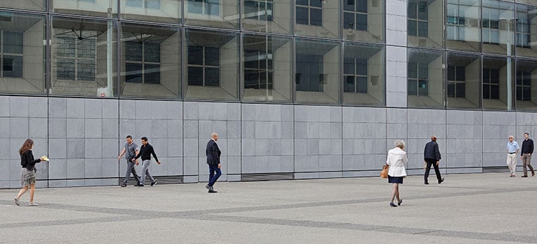 professionals working outside a building
